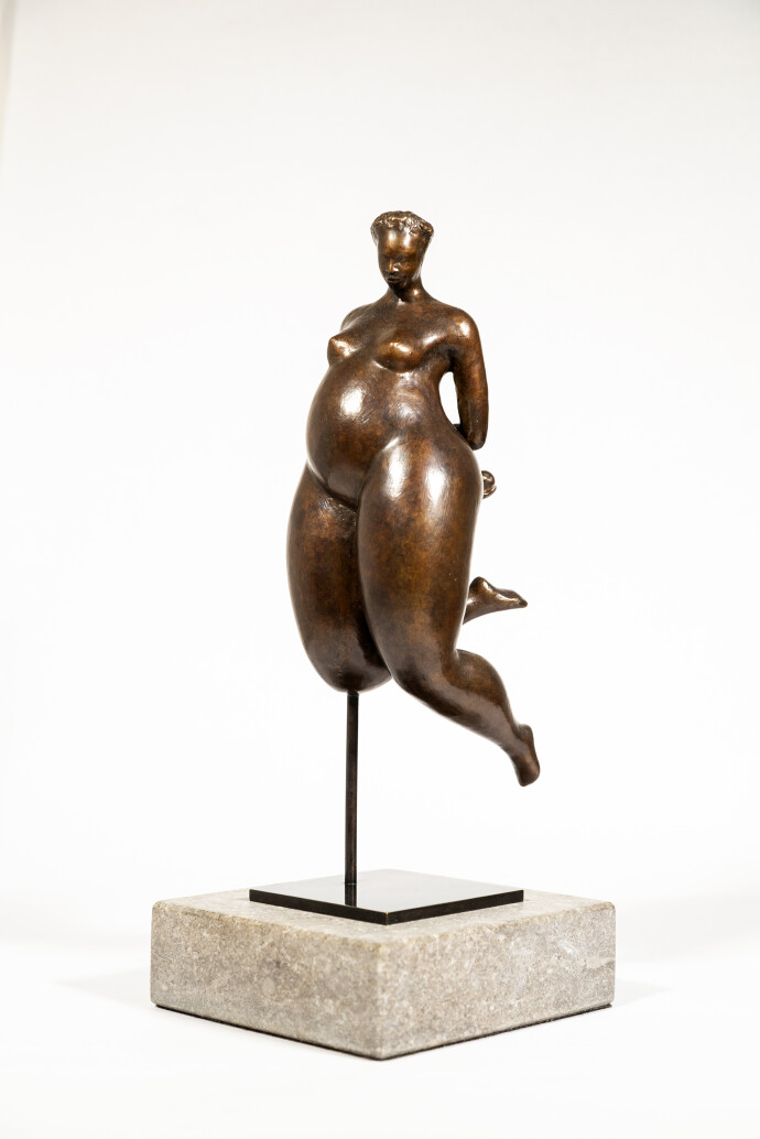 A voluptuous female figure is rendered in this compelling modern tabletop bronze sculpture by Paul Duval.