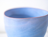 This contemporary blue ceramic vase has an organic shape inspired by nature. Image 6