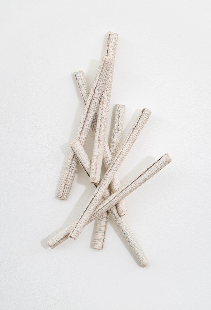 This contemporary sculptural ceramic wall composition is by Paula Murray.