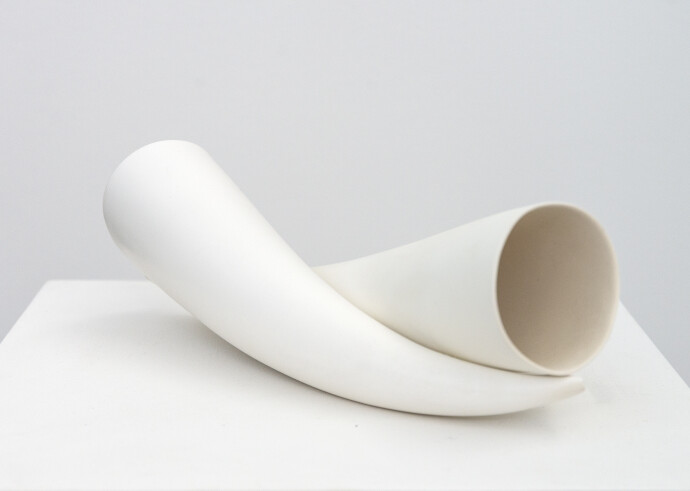 This contemporary white porcelain tabletop sculpture is by Paula Murray.