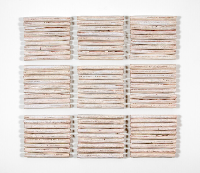 This contemporary white porcelain wall sculpture is by Paula Murray.