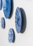 This contemporary horizontal wall composition by Paula Murray is composed of blue porcelain discs. Image 11