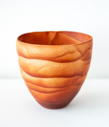 This contemporary saffron coloured ceramic vase has an organic shape inspired by nature.