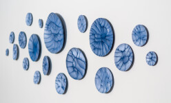 This contemporary horizontal wall composition by Paula Murray is composed of blue porcelain discs. Image 4
