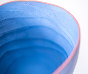 This contemporary blue ceramic vase has an organic shape inspired by nature. Image 8