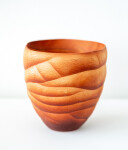 This contemporary saffron coloured ceramic vase has an organic shape inspired by nature. Image 4