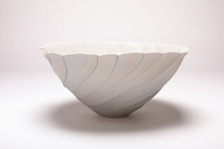 Delicate wave-like patterns swirl around this gorgeous vessel by Paula Murray.