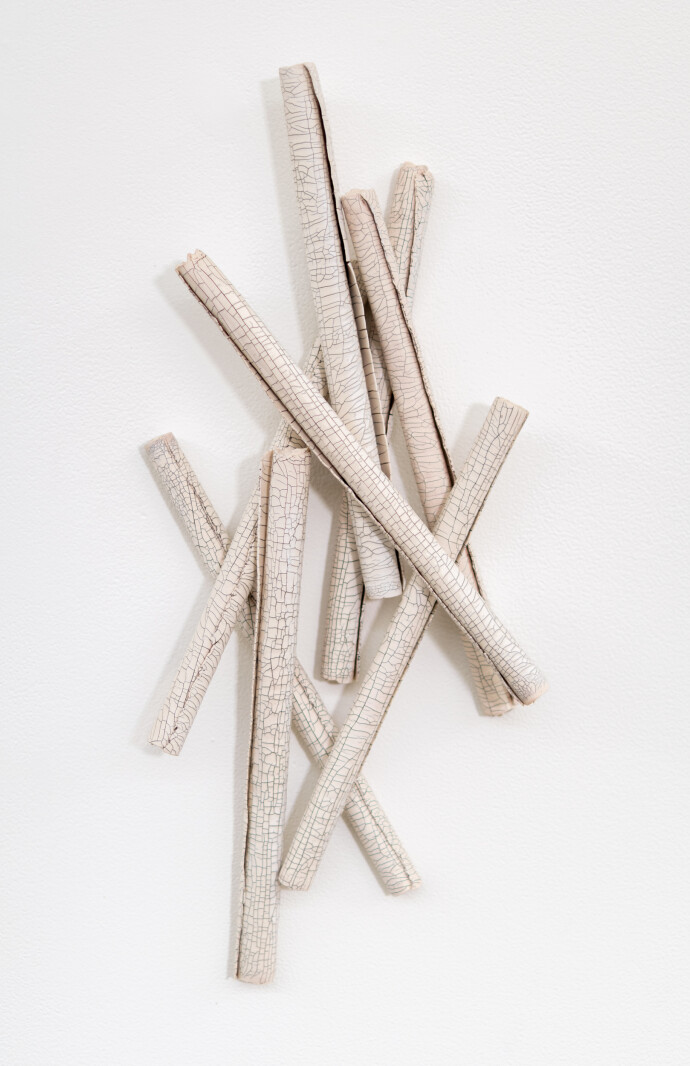 This contemporary sculptural ceramic wall composition is by Paula Murray.