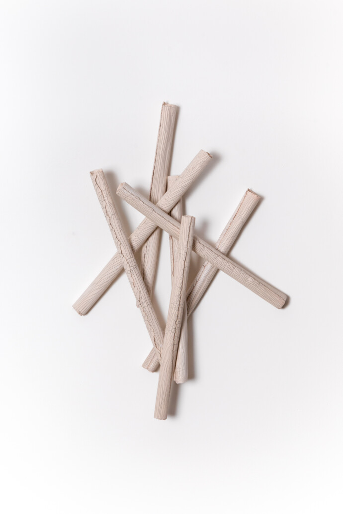 This contemporary sculptural ceramic wall composition is by Paula Murray.