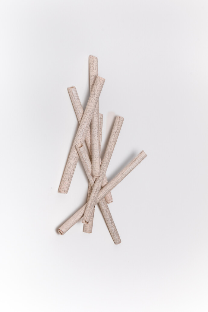 This contemporary sculptural ceramic wall composition is by Paula Murray.