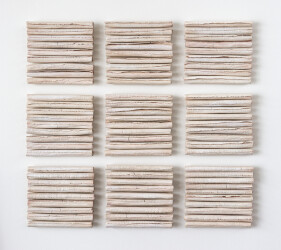 This contemporary white porcelain wall sculpture is by Paula Murray.