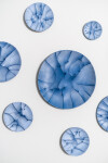 This contemporary horizontal wall composition by Paula Murray is composed of blue porcelain discs. Image 7