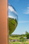 This contemporary outdoor architectural sculpture is forged from steel. Image 7