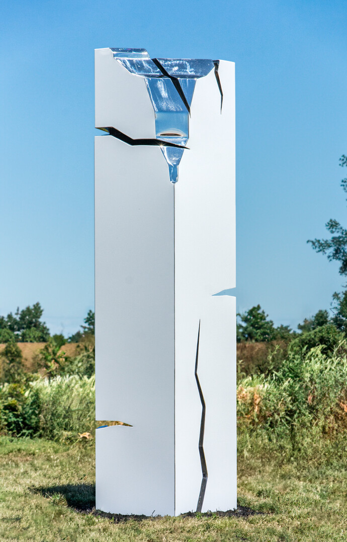 A pillar of stainless steel is coated white in this minimalist outdoor sculpture by Philippe Pallafray.