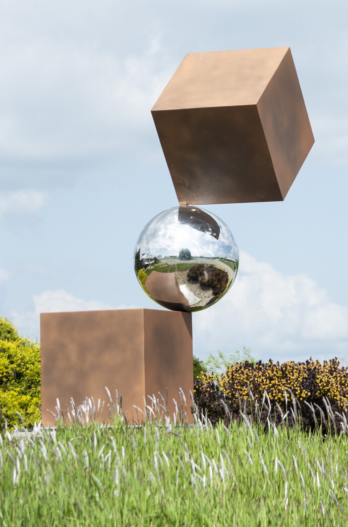 This geometric abstract outdoor sculpture is by Quebec artist Philippe Pallafray.