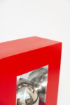 A highly polished stainless-steel ball framed by a rectangular cardinal red form appears to float in this dynamic table-top sculpture by Phi… Image 8