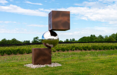 This contemporary outdoor metal sculpture is geometric in shape. Image 5