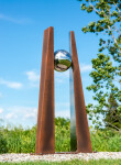 This contemporary outdoor architectural sculpture is forged from steel. Image 2