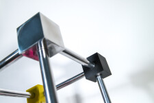 In this dynamic sculpture by Phillipe Pallafray, an open 3D stainless steel cube; each point connected by a brightly coloured solid cube in … Image 8