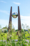 This contemporary outdoor architectural sculpture is forged from steel. Image 5
