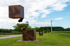 This contemporary outdoor metal sculpture is geometric in shape. Image 7
