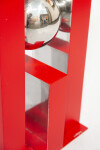 A highly polished stainless-steel ball framed by a rectangular cardinal red form appears to float in this dynamic table-top sculpture by Phi… Image 7