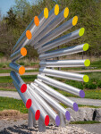 This modern contemporary outdoor sculpture is forged from steel in an abstract form. Image 2