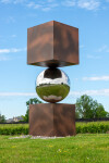 This contemporary outdoor metal sculpture is geometric in shape. Image 4