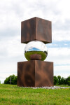 This contemporary outdoor metal sculpture is geometric in shape. Image 2