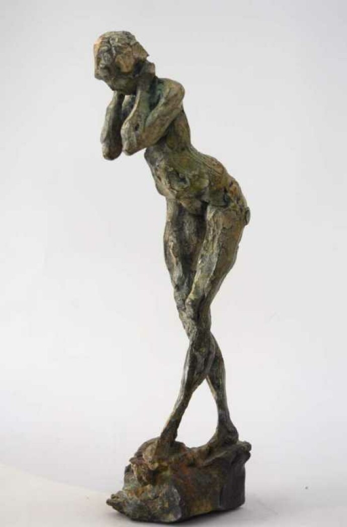 The elegant form of a nude female figure is captured in this sculpture by Canadian artist Richard Tosczak.