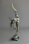 A ballet dancer on pointe—one leg raised high above her bowed head is captured in this dramatic bronze piece by Richard Tosczak. Image 4