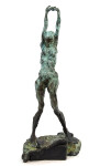 This bronze statuette of a female nude with arms stretched and straining above the head, the stabilizing legs on uneven ground was created r… Image 2