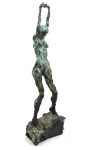This bronze statuette of a female nude with arms stretched and straining above the head, the stabilizing legs on uneven ground was created r… Image 3