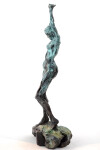 This bronze statuette of a female nude with arms stretched and straining above the head, the stabilizing legs on uneven ground was created r… Image 4