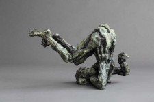 This dynamic sculpture by Richard Tosczak captures a nude female in an athletic pose—body tucked, head to one side as if rolling on the grou… Image 3