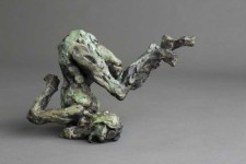 This dynamic sculpture by Richard Tosczak captures a nude female in an athletic pose—body tucked, head to one side as if rolling on the grou… Image 2