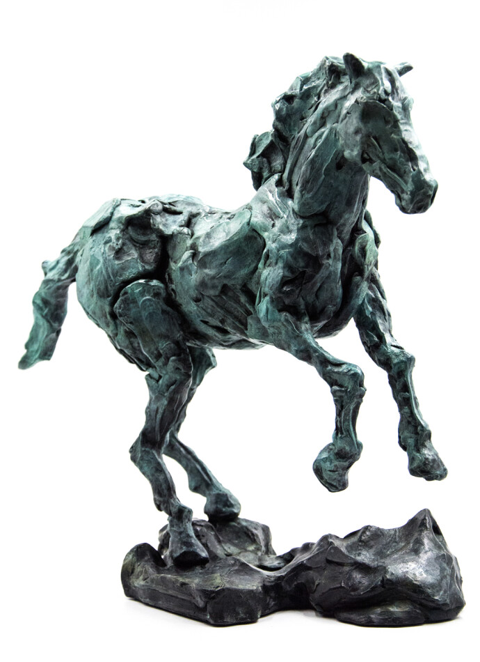The majesty and power of a horse as it rears up is captured in this dynamic bronze statuette by Canadian sculptor, Richard Tosczak.