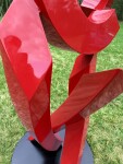 This large scale abstract metal sculpture in red painted metal is by Rob Lorenson. Image 5