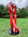 This large scale abstract metal sculpture in red painted metal is by Rob Lorenson. Image 2