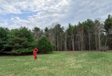 This large scale abstract metal sculpture in red painted metal is by Rob Lorenson. Image 8