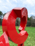 This large scale abstract metal sculpture in red painted metal is by Rob Lorenson. Image 4