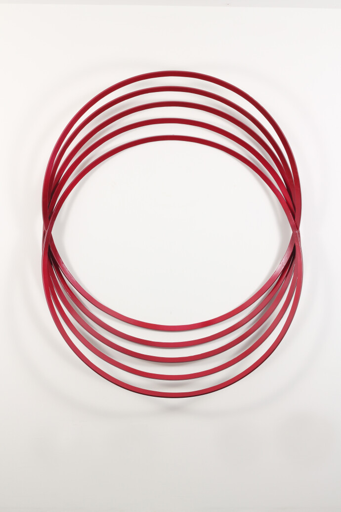 Candy apple red circles catch the eye in this arresting abstract steel wall hanging by Canadian artist Shayne Dark.