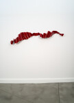 This contemporary wall sculpture is forged from steel and painted red. Image 2