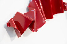 This contemporary wall sculpture is forged from steel and painted red. Image 8