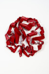 In a gorgeous candy coloured red, ribbons of steel swirl together curling and overlapping to form a circle. Image 4