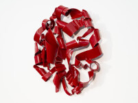 In a gorgeous candy coloured red, ribbons of steel swirl together curling and overlapping to form a circle. Image 5