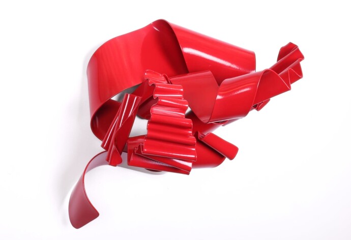 This contemporary wall sculpture is forged from steel and painted red.
