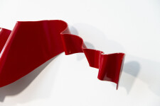 This contemporary wall sculpture is forged from steel and painted red. Image 7