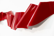 This contemporary wall sculpture is forged from steel and painted red. Image 5