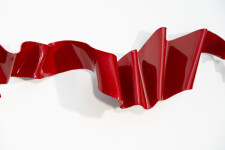 This contemporary wall sculpture is forged from steel and painted red. Image 9